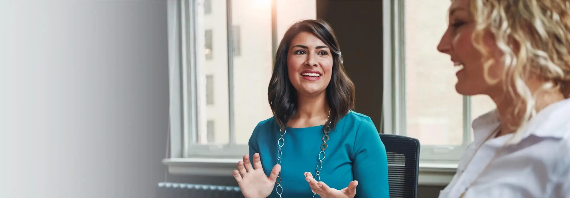 Woman smiling while talking with a counselor