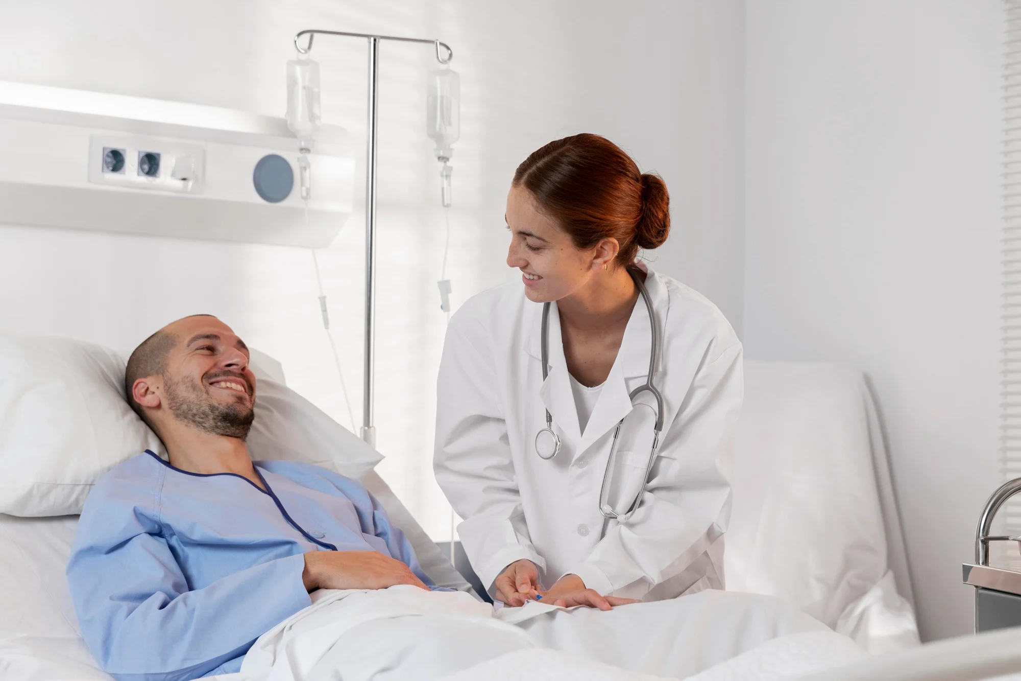 Nurse caring for a patient resting in a medical bed